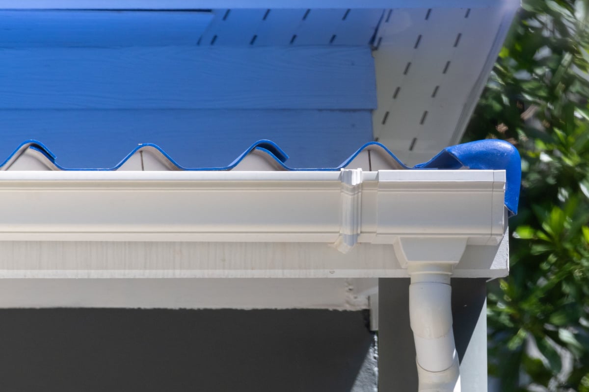 Clean white gutter system on a home